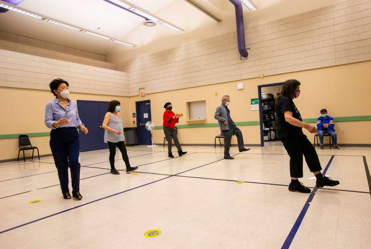 Dance instructor Irma Achey, right, leads a line dancing class at the West Flamingo Senior Cent ...