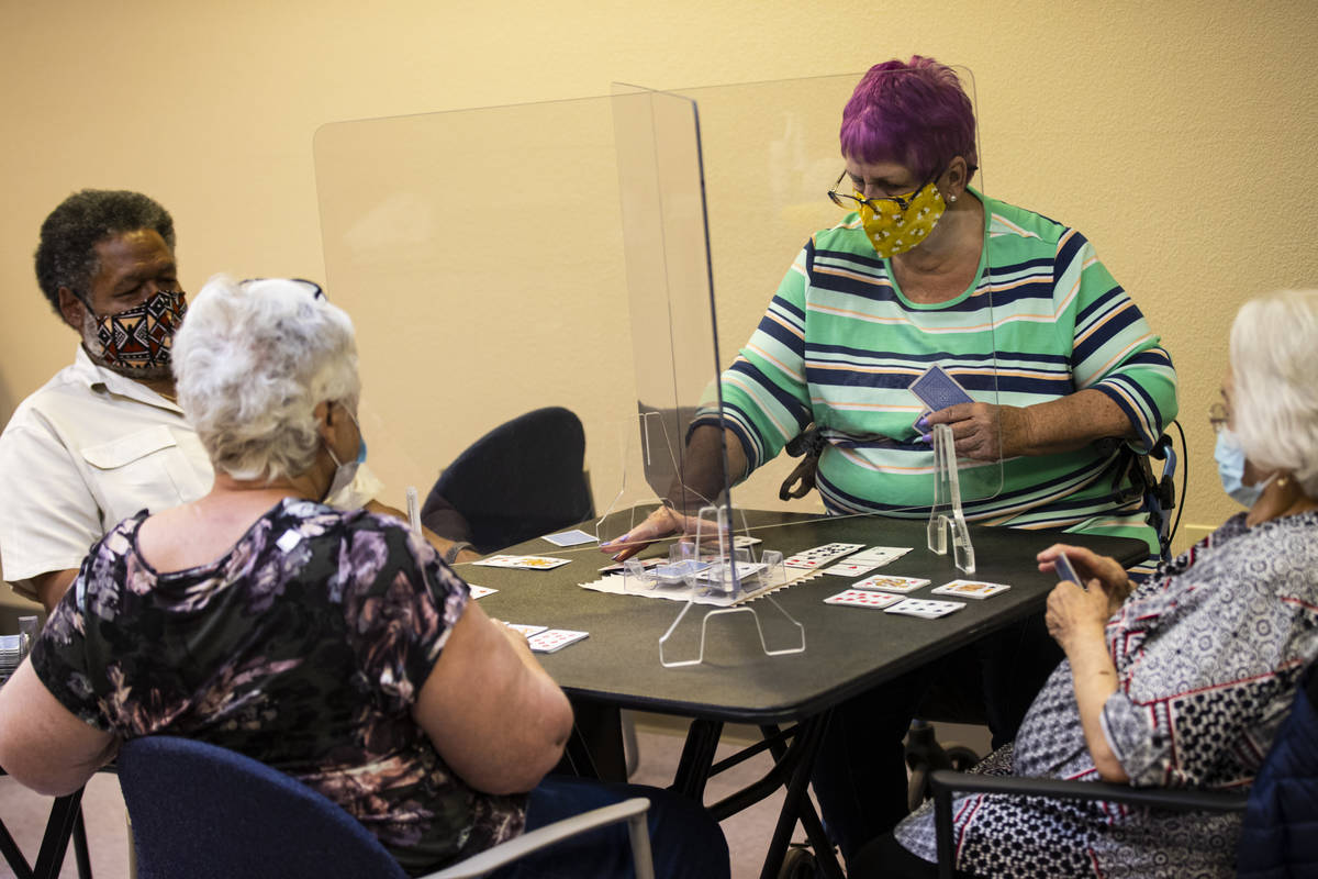 Dotty Ducret, right, and Gordon Dew, left, play the card game canasta at the West Flamingo Seni ...