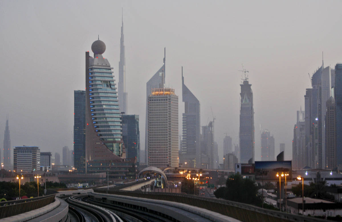 This Sept. 18, 2009 picture shows Burij Dubai, world's tallest tower under construction, center ...
