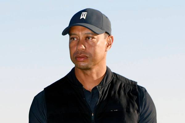 FILE - In this Feb. 21, 2021, file photo, Tiger Woods looks on during the trophy ceremony on th ...
