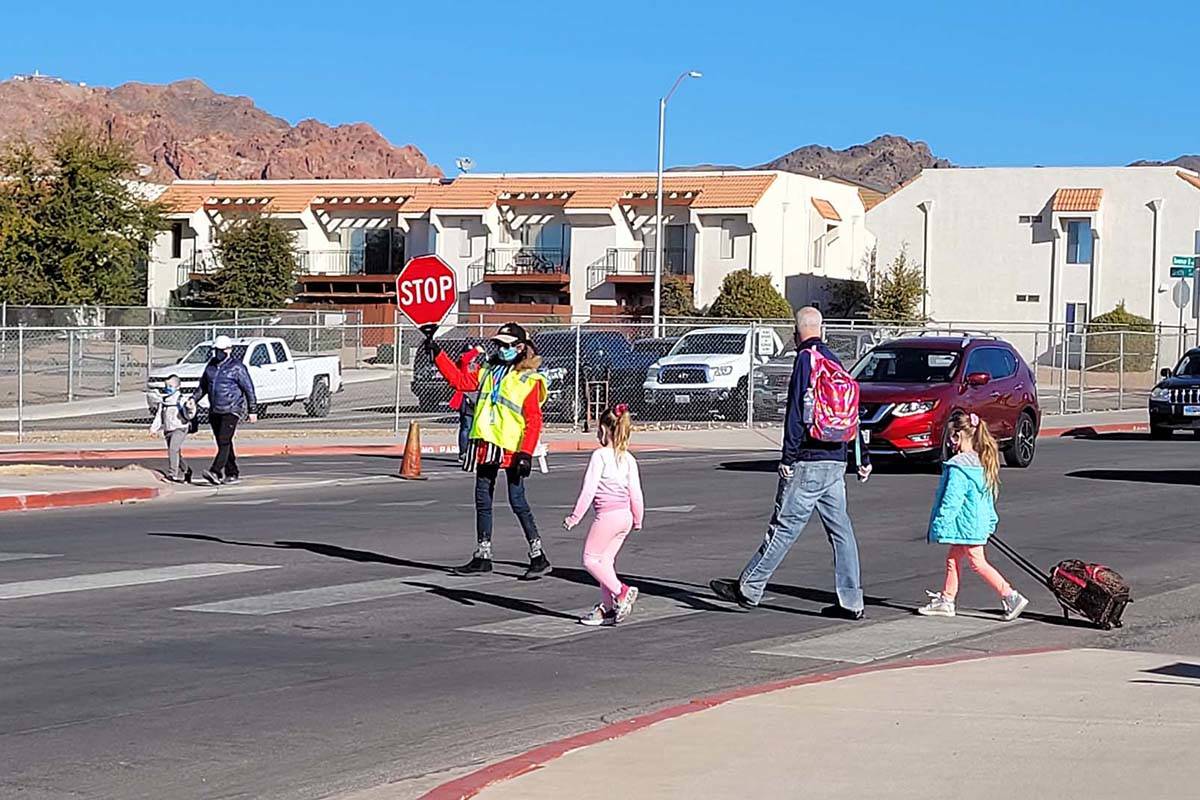 Local crossing guards are back in action helping students arrive to school on the second day of ...