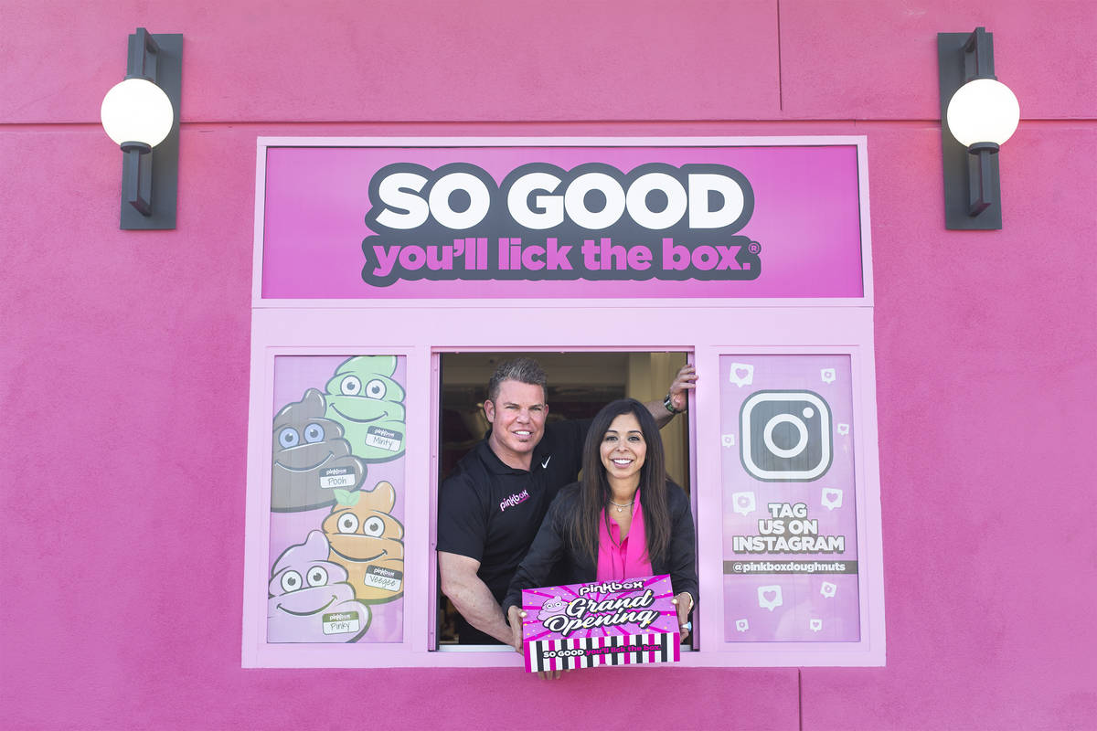 Pinkbox Doughnuts owners Stephen Siegel and Judith Siegel in the drive-thru of their new store ...