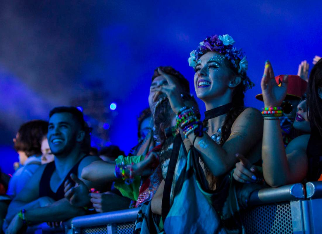 Attendees react as Excision performs at the Kinetic Field stage during the first day of the Ele ...
