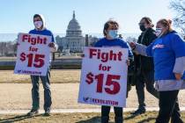 Activists appeal for a $15 minimum wage near the Capitol in Washington, Thursday, Feb. 25, 2021 ...