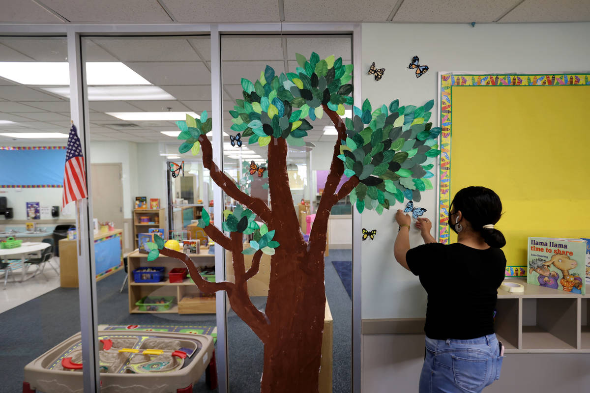 Teachers assistant Angela Hofer sets up a classroom at Capstone Christian Academy in Las Vegas ...