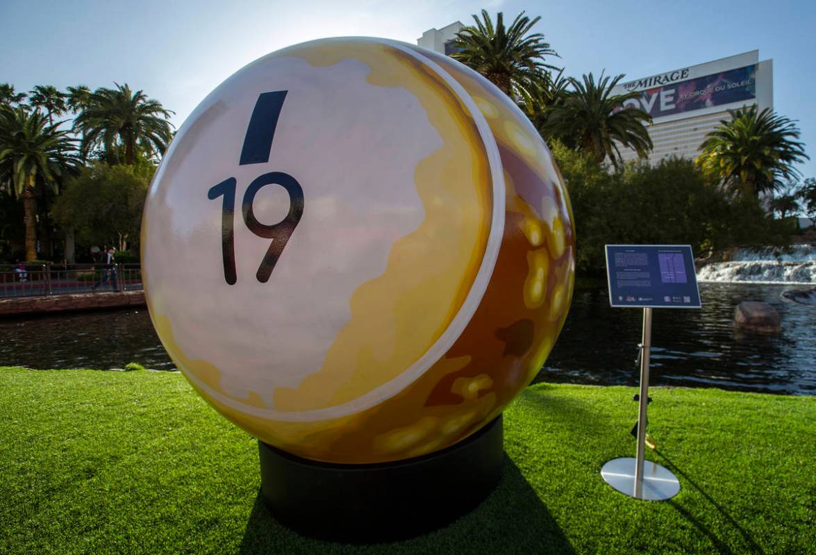 A 200-pound bingo ball by artist Jerry Misko is displayed in front of The Mirage Volcano on Tue ...