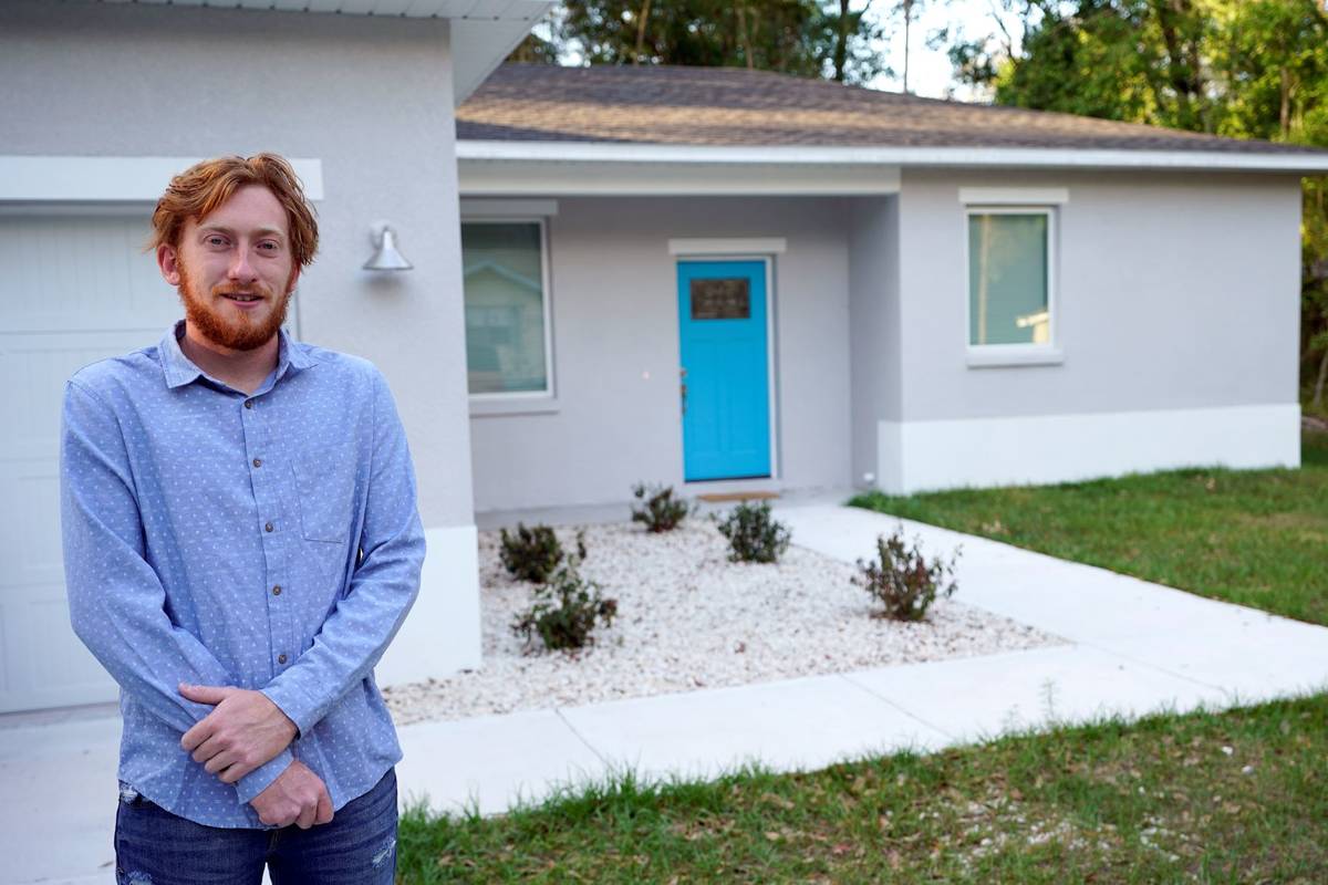 First-time buyer Kevin Muglach stands in front of his new home, Tuesday, April 6, 2021, in Oran ...