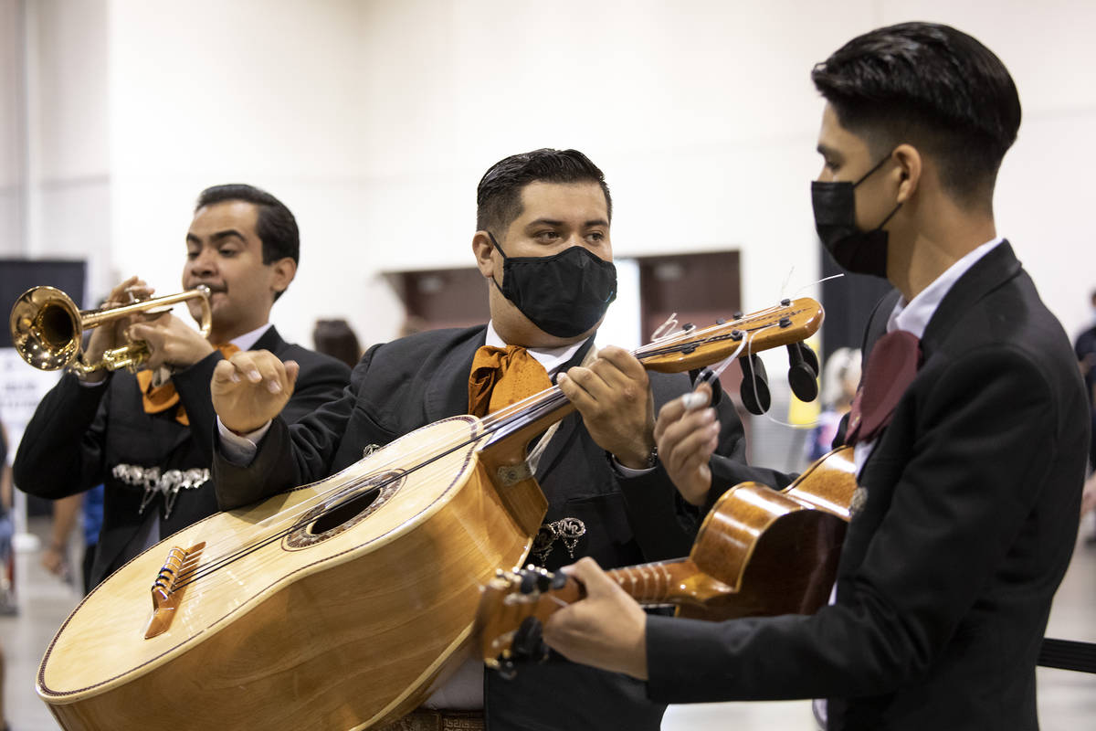 Andres Villalobos, Armulfo Reyna and Ceasar Arciga perform as part of Mariachi Nuestras Raices ...