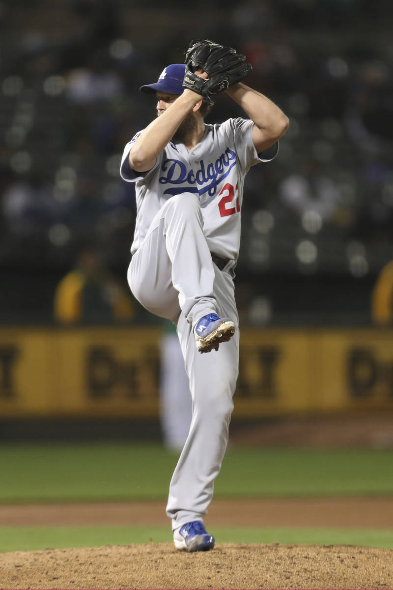Los Angeles Dodgers pitcher Clayton Kershaw winds up during the seventh inning of the team's ba ...