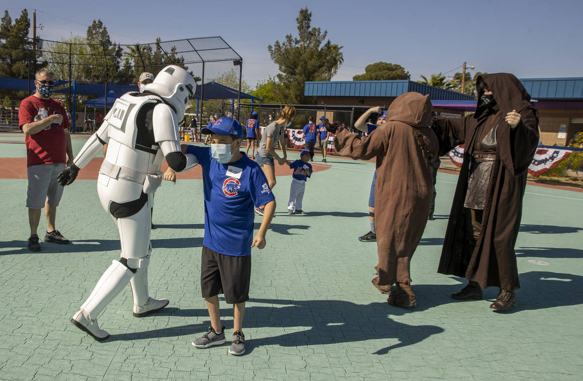 Player Gianni Szott, 11, does the ÒChicken DanceÓ with a Star Wars Stormtrooper in th ...