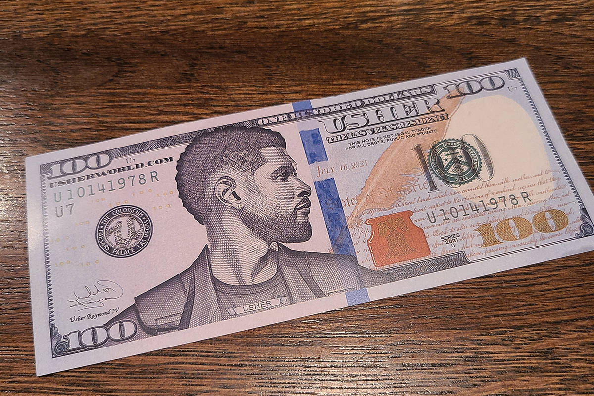 Usher's commemorative $100 bill is shown at Esther's Kitchen in the Arts District on Tuesday, M ...