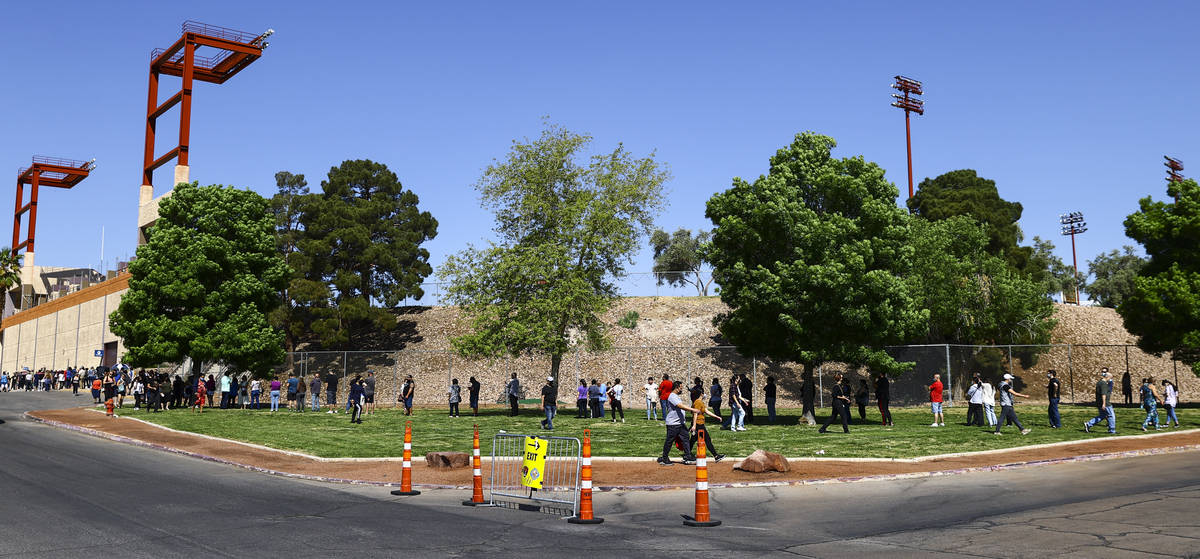 People wait in line at the COVID-19 vaccination site at Cashman Center in Las Vegas on Tuesday, ...