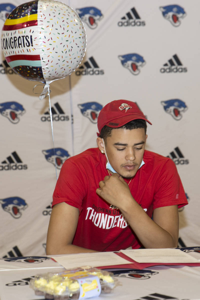 Desert Pines senior reads his commitment letter to the Southern Utah University during a signin ...
