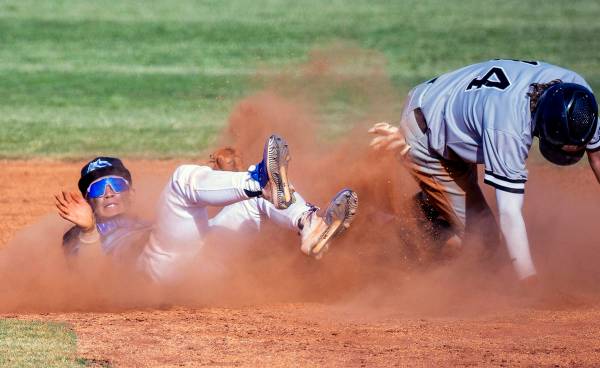 Basic 2B Ty Southisene (3) is knocked to the dirt but makes the out on Palo Verde runner Cal Er ...
