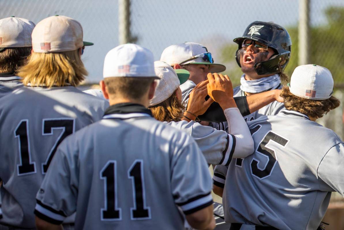 Palo Verde hitter Tommy DiLandri (7) is pumped up as he scores versus Basic during an NIAA base ...