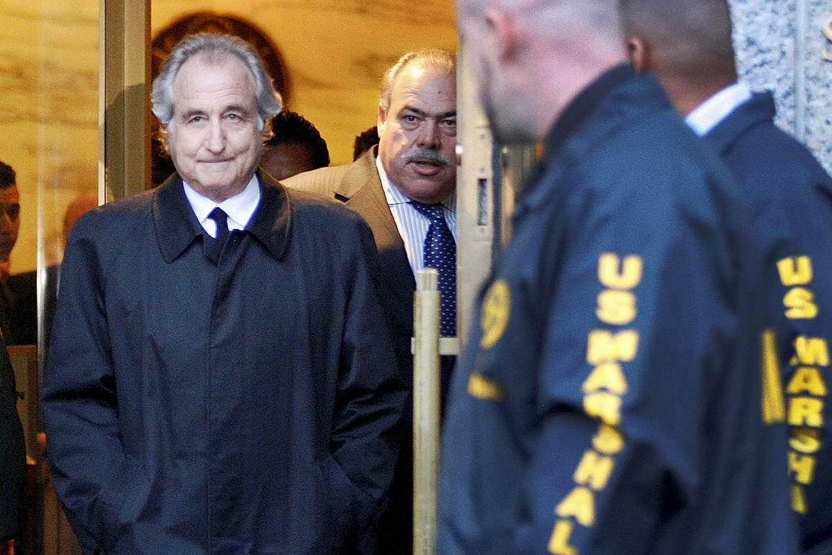 FILE - Disgraced financier Bernard Madoff leaves U.S. District Court in Manhattan after a bail ...