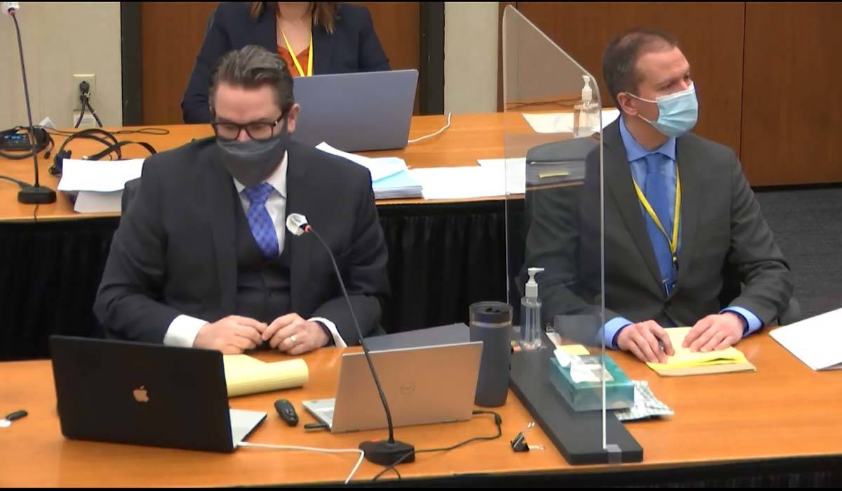 In this image from video, defense attorney Eric Nelson, left, defendant, former Minneapolis pol ...
