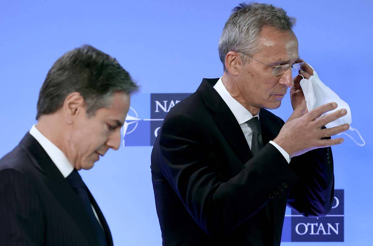 NATO Secretary General Jens Stoltenberg, right, and United States Secretary of State Antony Bli ...