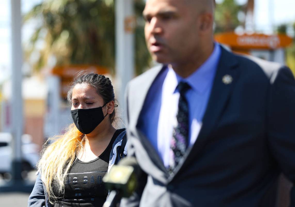 Jenifer Torres, left, wife of Kashif Brown, listens as Metropolitan Police Department homicide ...