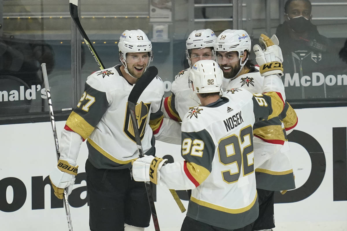 Vegas Golden Knights right wing Alex Tuch (89) celebrates with team mates after he scored a goa ...