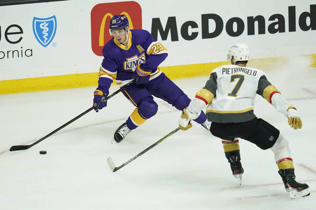 Los Angeles Kings right wing Dustin Brown (23) takes control of the puck from Vegas Golden Knig ...