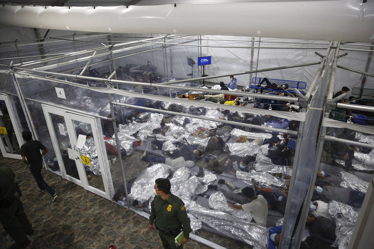 Minors are seen inside a pod at the Donna Department of Homeland Security holding facility in D ...