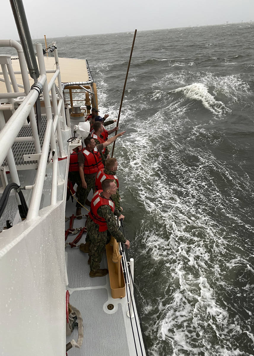 In this photo provided by the U.S. Coast Guard, crew members of the Coast Guard Cutter Glenn Ha ...