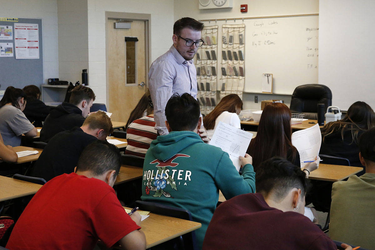 Spencer Skees, Desert Oasis High School math teacher, supervises his student's test in 2018 in ...
