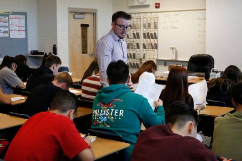 Spencer Skees, Desert Oasis High School math teacher, supervises his student's test in 2018 in ...