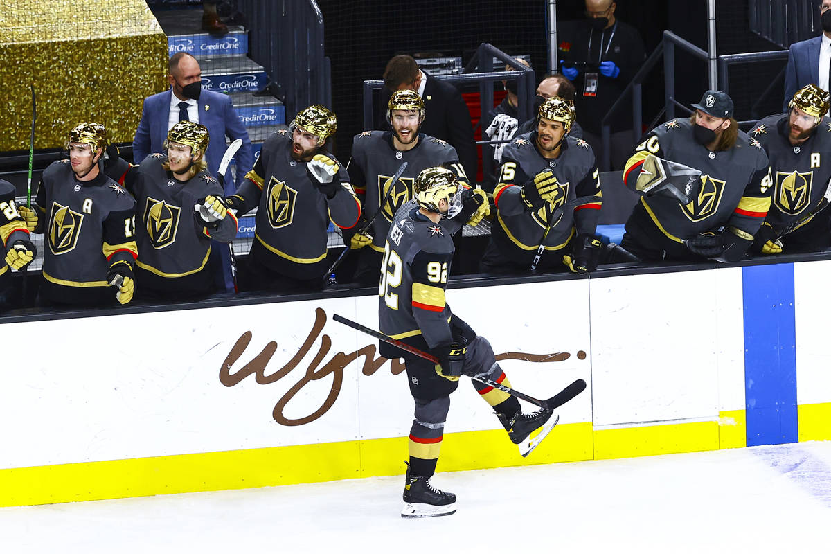 Golden Knights' Tomas Nosek (92) celebrates with teammates after scoring against the Arizona Co ...