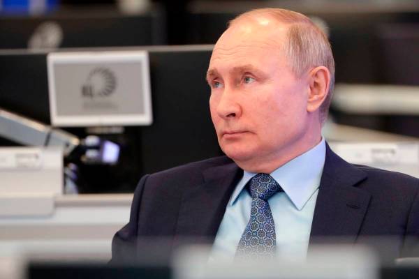 Russian President Vladimir Putin visits the Coordination Center of the Russian Government in Mo ...