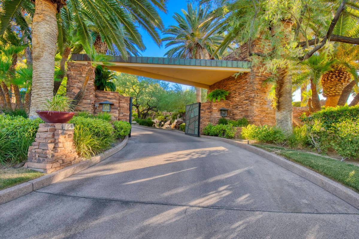 The home on Enclave Court in the exclusive Country Club Hills in Summerlin has its own gate for ...