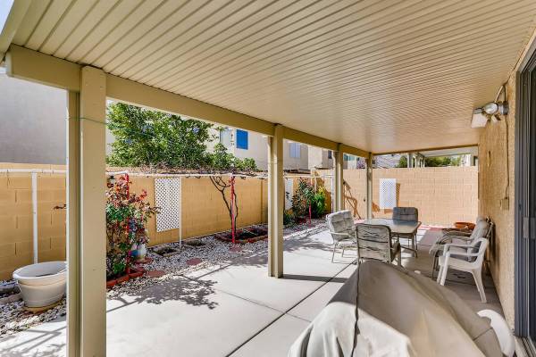 The covered patio at 9137 Dorrell Lane is an entry point for backyard activities. (Virtuance)