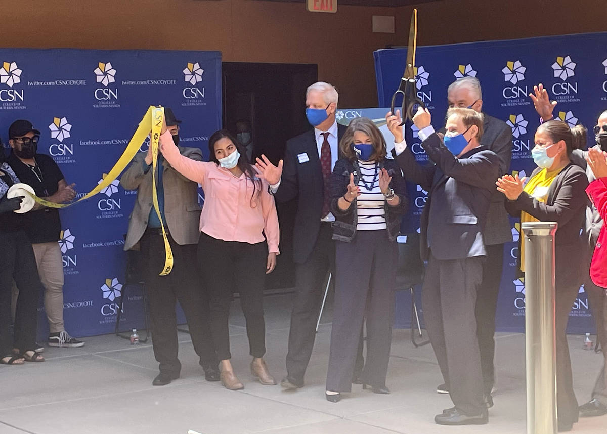 Elected officials and College of Southern Nevada students and employees participate in a ribbon ...