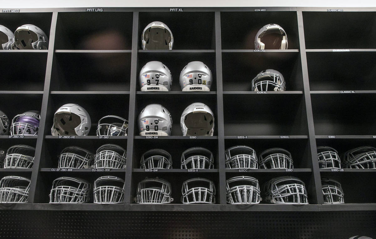 Helmets and face masks in the equipment room within the Las Vegas Raiders headquarters on Wedne ...