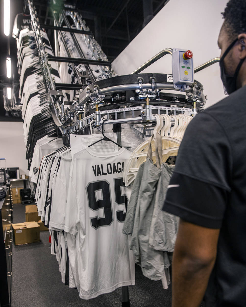 A rack of jerseys spins around in the equipment room within the Las Vegas Raiders headquarters ...
