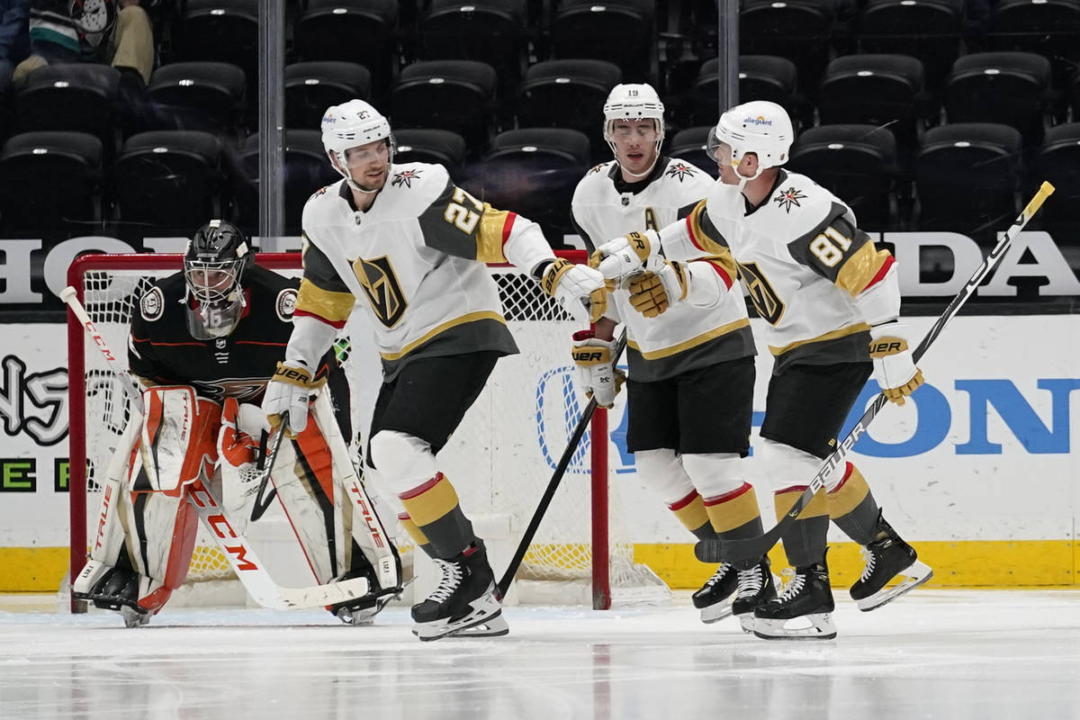 Vegas Golden Knights defenseman Shea Theodore (27), right wing Reilly Smith (19), and center Jo ...