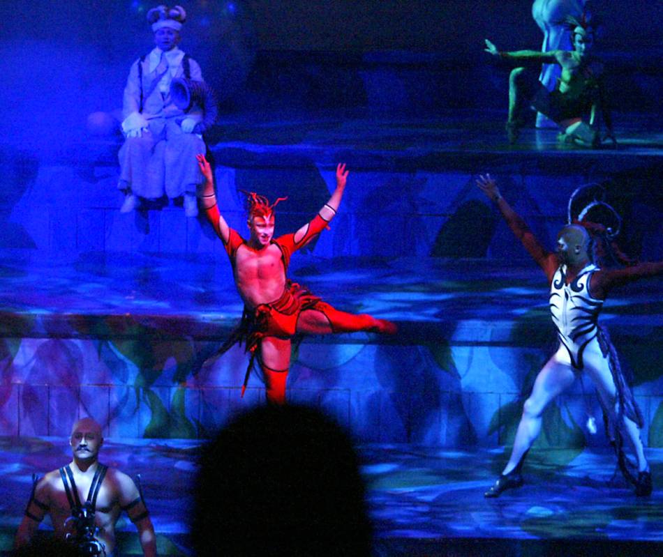 Cast members perform during the Cirque du Soleil "Mystere" show in the Mystere Theater at Treas ...
