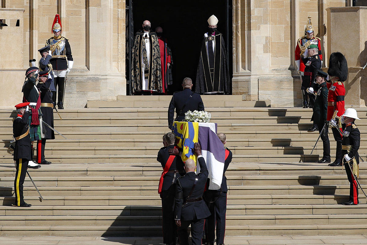 The coffin is carried inside the St George's Chapel for the funeral of Britain's Prince Philip ...