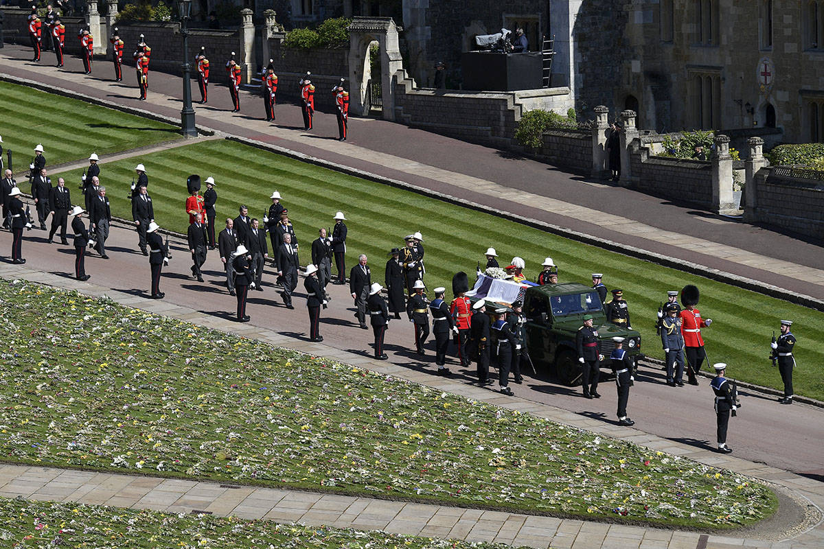 The coffin is carried on a Land Rover during the procession for the funeral of Britain's Prince ...