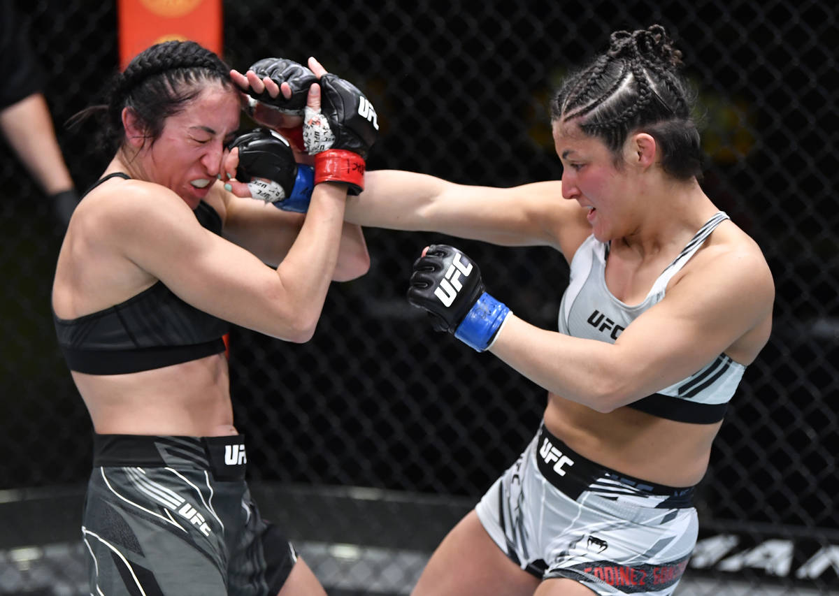 Loopy Godinez of Mexico punches Jessica Penne in a strawweight fight during the UFC Fight Night ...
