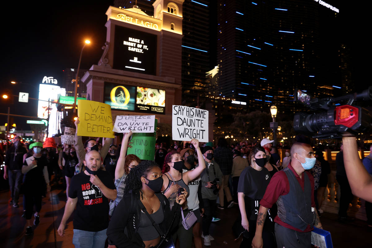People protest at the Bellagio on the Strip in Las Vegas Saturday, April 17, 2021, following th ...