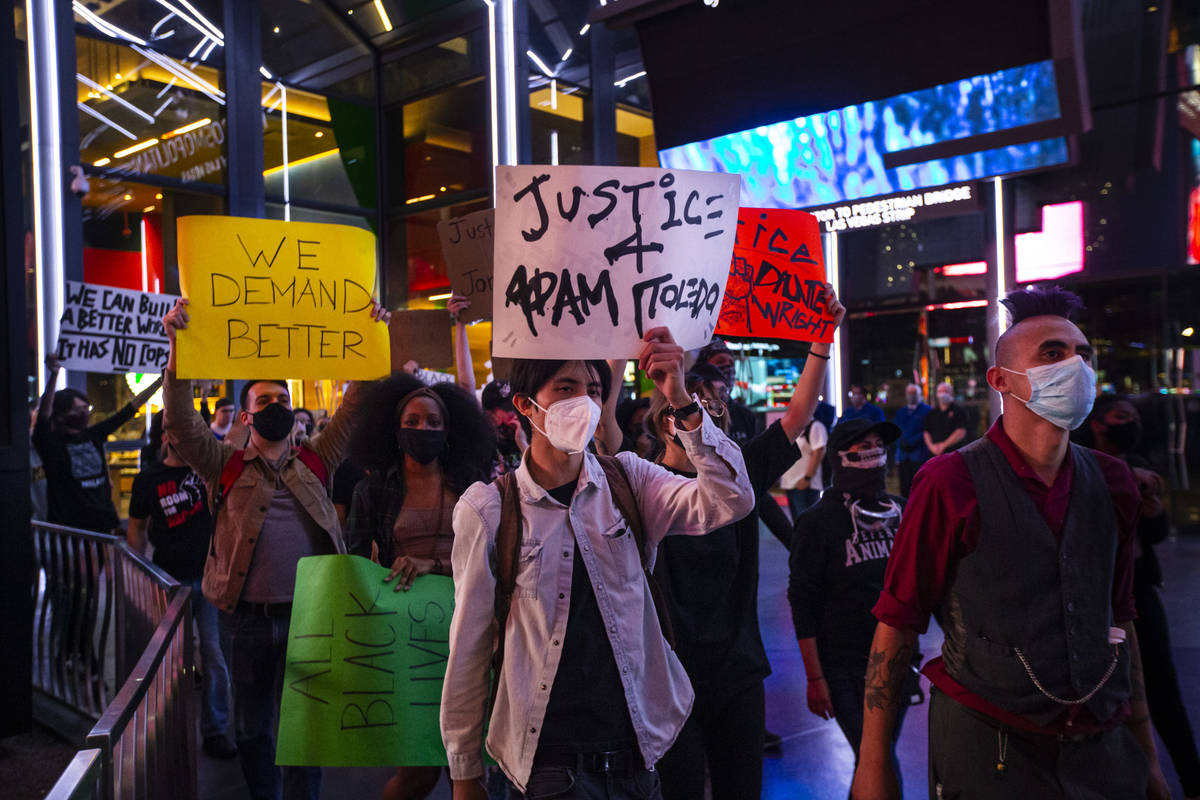 People participate in a demonstration in solidarity with the families of Daunte Wright and Adam ...