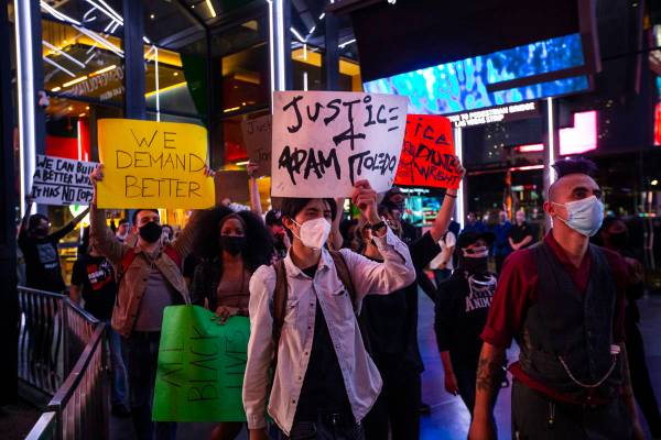 People participate in a demonstration in solidarity with the families of Daunte Wright and Adam ...