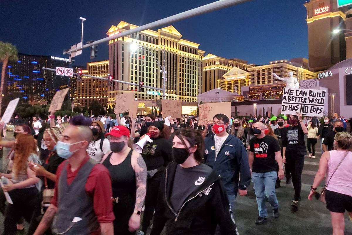 Protesters march on the Las Vegas Strip on Saturday, April 17, 2021. (Chase Stevens/Las Vegas R ...