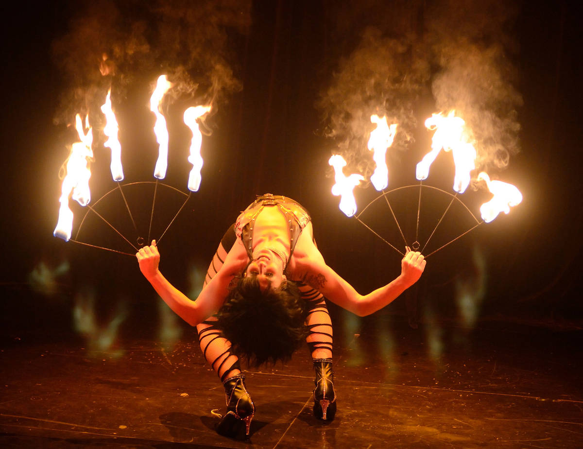 Jen Romas performs with fire during the "iCandy Burlesque" show at the Saxe Theater in the Mira ...