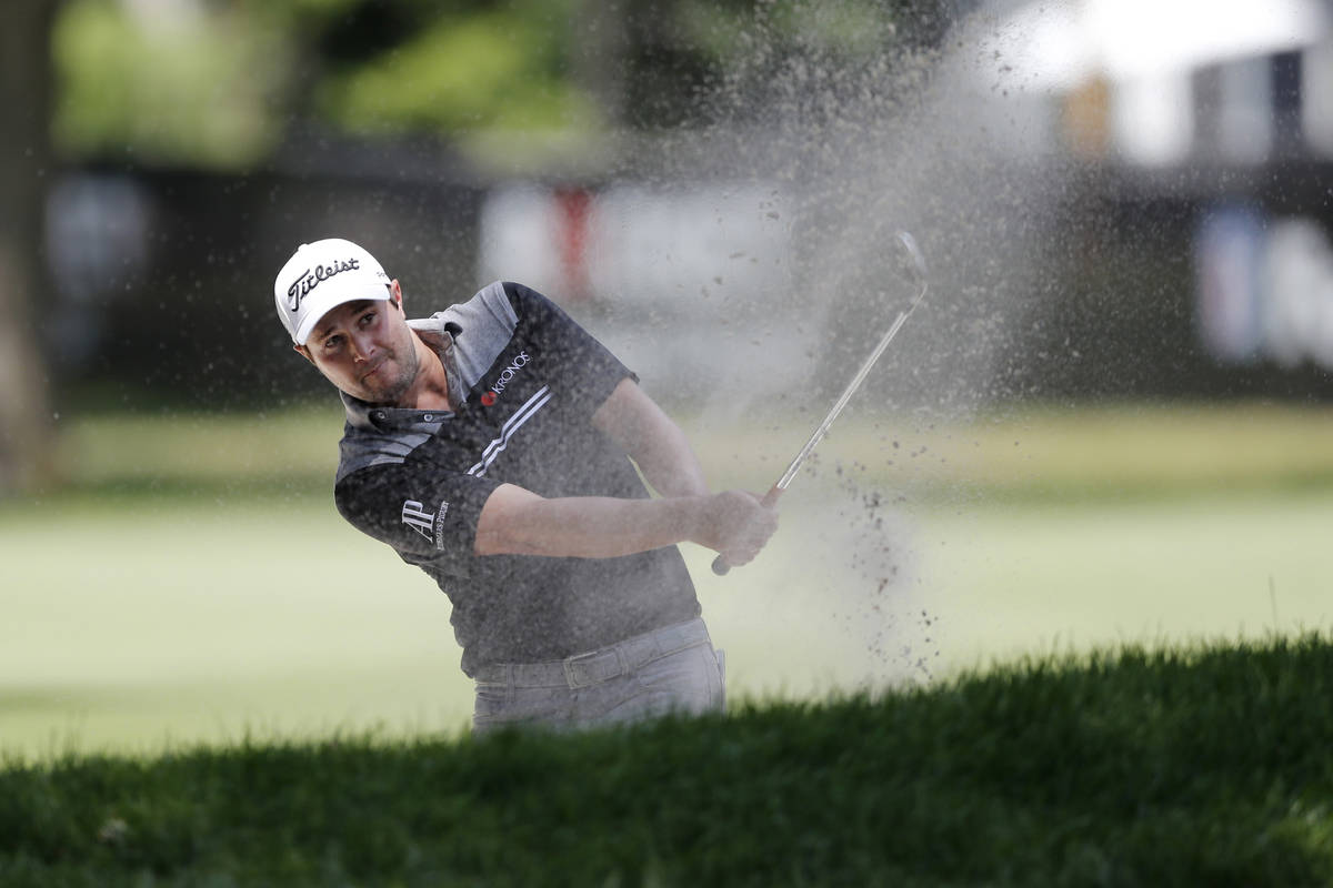 Peter Uihlein hits from the sand on the eighth hole during the second round of the Rocket Mortg ...