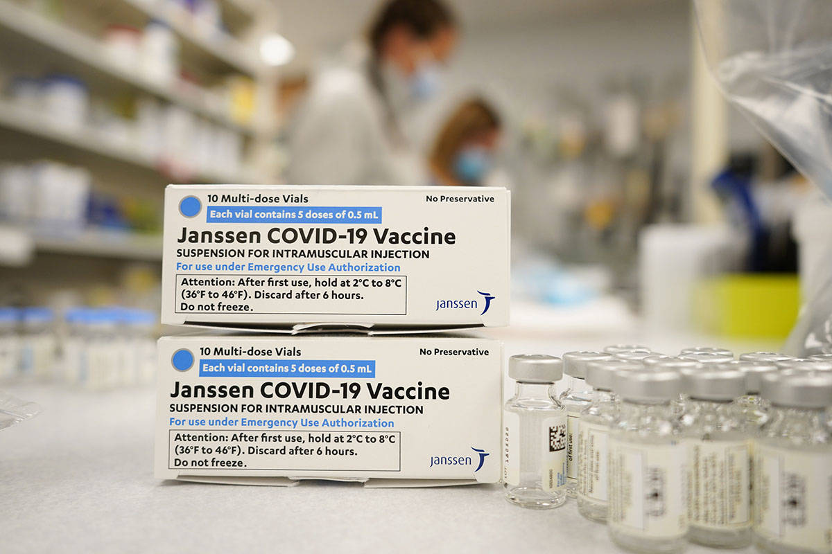 FILE - In this March 6, 2021, file photo, boxes stand next vials of Johnson & Johnson COVID-19 ...
