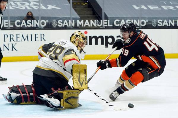 Vegas Golden Knights goaltender Marc-Andre Fleury, left, stops a shot from Anaheim Ducks left w ...