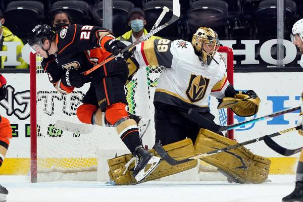 Anaheim Ducks' Sam Steel (23) collides with Vegas Golden Knights goaltender Marc-Andre Fleury ( ...